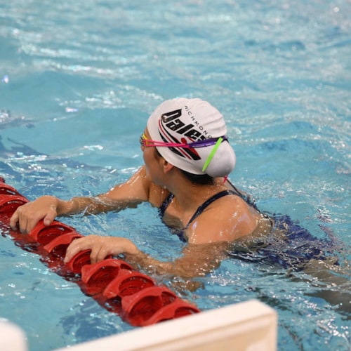 Swimmers lined up in the pool